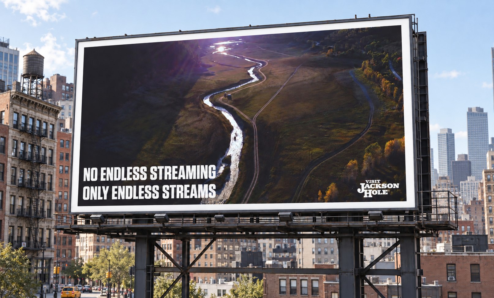 Billboard: 'No endless streaming, only endless streams,' over an aerial shot of a winding river